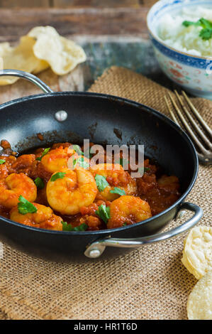 Prawn curry with rice and popodoms Stock Photo