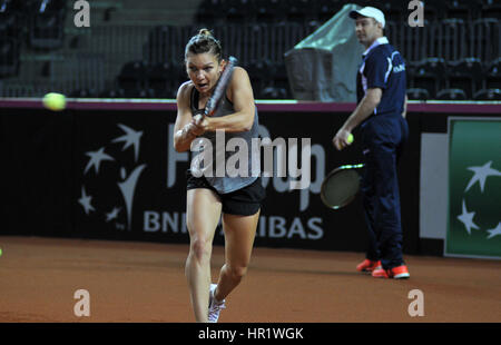 CLUJ-NAPOCA, ROMANIA - APRIL 15, 2016: Romanian tennis player Simona Halep (WTA ranking 6) plays during the training before the match against Germany Stock Photo