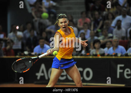 CLUJ-NAPOCA, ROMANIA - APRIL 17, 2016: WTA 6 ranked woman tennis player Simona Halep plays against Angelique Kerber during a Fed Cup Play-Offs Tennis  Stock Photo
