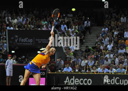 CLUJ-NAPOCA, ROMANIA - APRIL 17, 2016: WTA 6 ranked woman tennis player Simona Halep plays against Angelique Kerber during a Fed Cup Play-Offs Tennis  Stock Photo