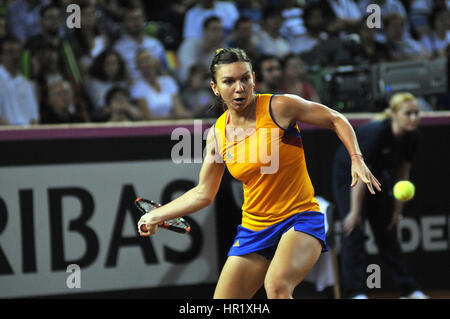 CLUJ-NAPOCA, ROMANIA - APRIL 17, 2016: WTA 6 ranked woman tennis player Simona Halep plays against Angelique Kerber during a Fed Cup Play-Offs Tennis  Stock Photo