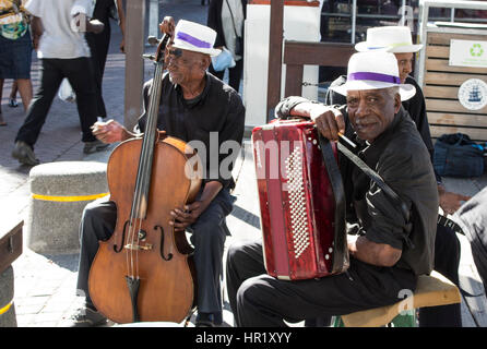 Two street musician, a cellist and a accordionist at the waterfront in Cape Town. Stock Photo