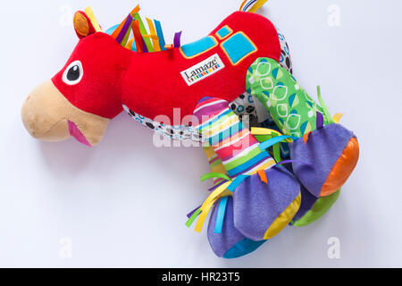 Lamaze Trotter the pony toy set on white background Stock Photo