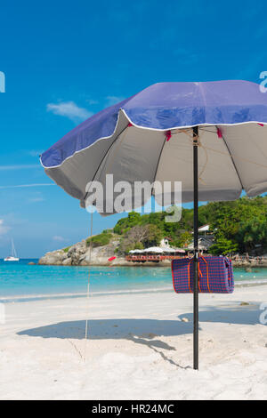 Beach umbrella, or parasol in Raya island, Thailand Stock Photo
