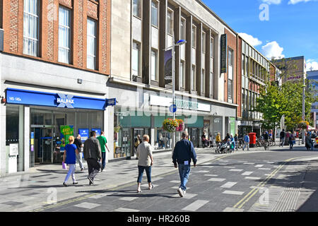 Slough Berkshire UK high street retail shopping centre Halifax Bank Branch & M&S store people walk along paved-over road prioritised for pedestrians Stock Photo