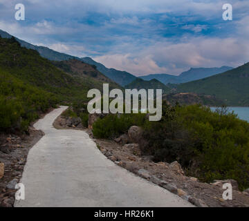 Road leading into the mountains Stock Photo