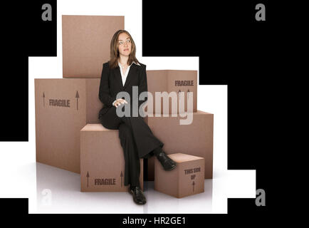business woman with packed cardboard boxes over a white background Stock Photo