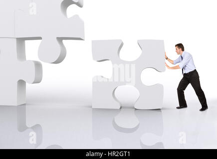 business man building a 3d puzzle over white Stock Photo