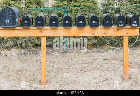 a bank of black mail boxes with numbers Stock Photo