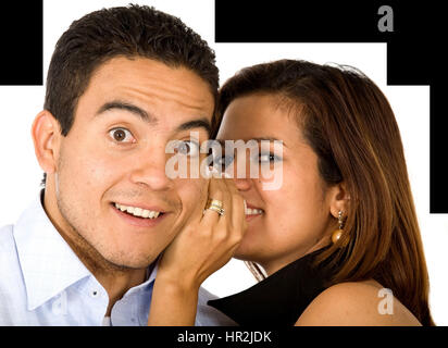 Business woman telling a businessman a secret - surprise and fun faces - over a white background Stock Photo