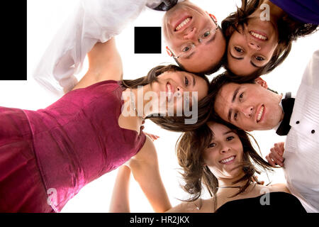 friends portrait having fun all elegantly dressed ready to party over a white background Stock Photo