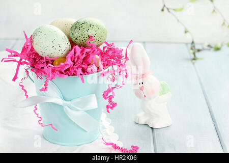 Easter eggs in a blue tin bucket. Shallow depth of field. Stock Photo