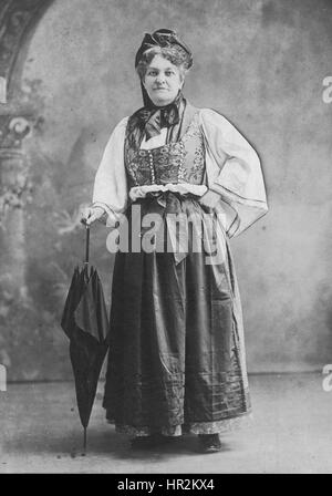 Ethnic woman with black umbrella and hat.  Photo by A.A. Krueter, Elkhart Lake, Wis. USA, c.1907    To see my other vintage images, Search:  Prestor  vintage Stock Photo