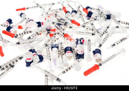 Insulin syringes and lancets on a white background Stock Photo