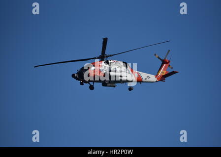 HH-60 Jayhawk helicopter used by US Coast Guard in flight over San Diego Harbor, California. Stock Photo