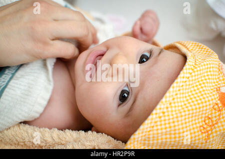 newborn eyes closeup gaze baby face portrait hood Stock Photo