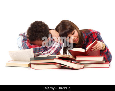 Teenage couple studying, the boy falling asleep on the books Stock Photo