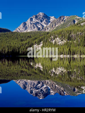 carpp lake reflecting warren peak in the anaconda-pintler wilderness near georgetown, montana Stock Photo