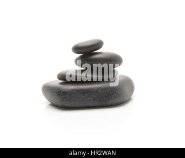 Heap of spa hot stones isolated on white Stock Photo - Alamy