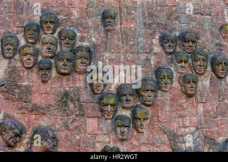 Close-up of faces dating from communist era on façade of City market in Kutaisi, Imereti Region, Georgia, Caucasus, Middle East, Asia Stock Photo
