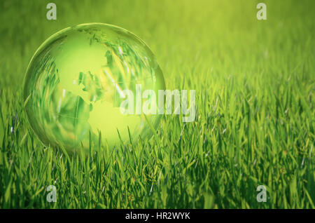 Globe lies on green grass. Concept - Earth Day Stock Photo - Alamy