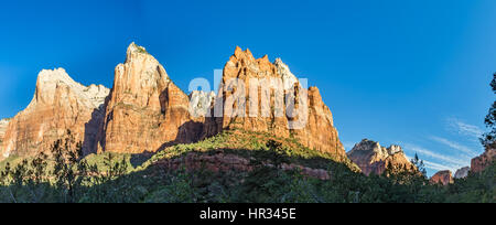 The Patriarchs are three neighboring sandstone peaks on the west side of Zion Canyon. Each is named after biblical fathers. From left to right (south  Stock Photo