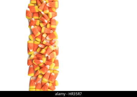 Candy Corns in Vertical Row on Isolated White Background Stock Photo