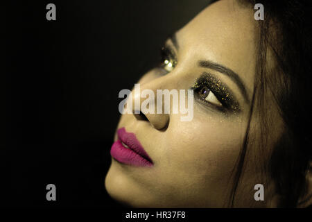 Close-up of young woman looking up Stock Photo