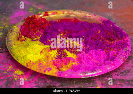 Plate with colorful dyes used for Holi festival in India Stock Photo