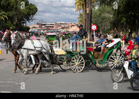 Marrakesh, Morocco.  Tourist Family in Horse-drawn Carriage. Stock Photo