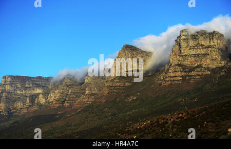The beautiful 12 Apostles mountain range as seen from Victoria road between Hout Bay and Camps bay. Stock Photo