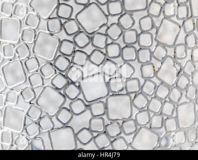 detail of a table base seen located near a pool Stock Photo