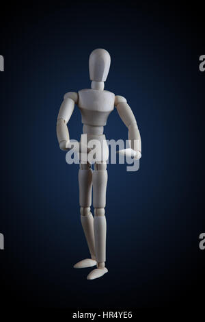 Wooden figurine flexing muscles in bodybuilder pose on dark background Stock Photo