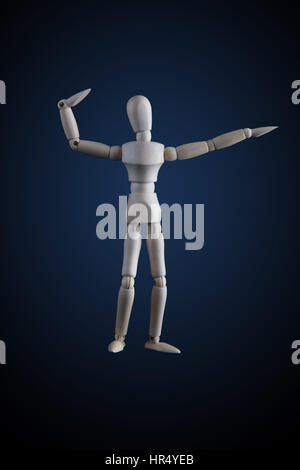 Wooden figurine flexing muscles in bodybuilder pose on dark background Stock Photo