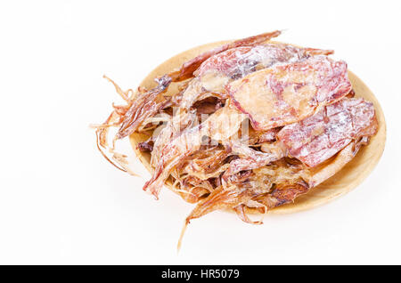 Dried squids in wooden dish isolated on white background. Stock Photo