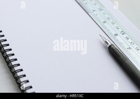 Blank White Paper of Wirebound Notebook with Mechanical Pencil and Stainless Ruler. Stock Photo