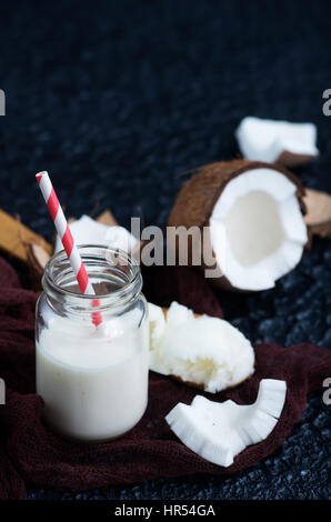 coconut products on a table, coconut milk and butter Stock Photo