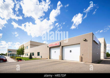 Exterior of hospital parking garage against sky on sunny day Stock Photo