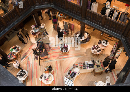 Liberty interiors with customers. Liberty is an historic iconic luxury department store on Great Marlborough Street in the West End of London, UK Stock Photo