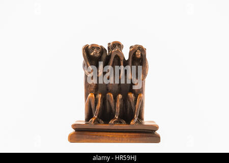 Miniature model of three wise monkeys 'hear no evil, speak no evil, see no evil' (white background) Stock Photo