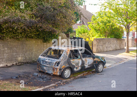 Abandoned and burnt out car after a car theft. In Gravesend Kent. Stock Photo