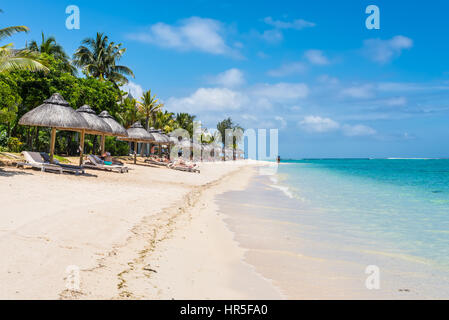 Le Morne, Mauritius - December 7, 2015: People relax on the Le Morne Beach Brabant, one of the finest beaches in Mauritius and the site of many hotels Stock Photo