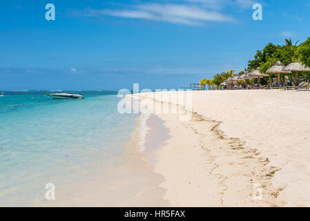 Le Morne, Mauritius - December 7, 2015: People relax on the Le Morne Beach Brabant, one of the finest beaches in Mauritius and the site of many hotels Stock Photo