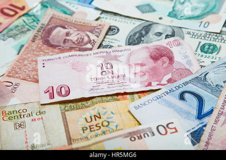 Background from paper money of the different countries. Turkish lira in the middle Stock Photo