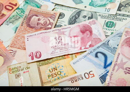 Background from paper money of the different countries. Turkish lira in the middle Stock Photo