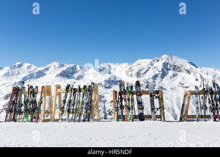 Skis and snowboards on racks outside a cafe on the slopes at Hochgurgl, Austria Stock Photo