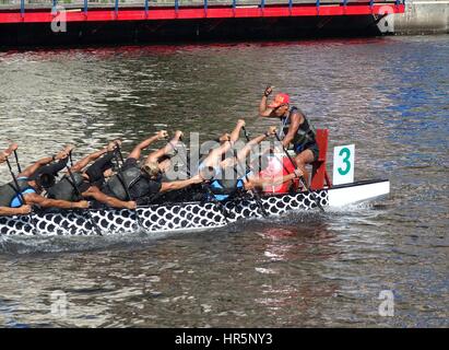 KAOHSIUNG, TAIWAN -- MAY 27, 2016: An unidentified team trains on the Love River in preparation for the upcoming Dragon Boat Festival. Stock Photo