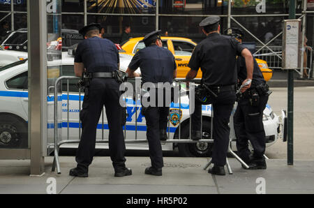 New York City, USA - September 26, 2012: Back view of NYPD police officers at work in New York City. Stock Photo