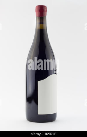 Red wine bottle isolated on white - full of red wine standing upright with red wax seal over cork Stock Photo