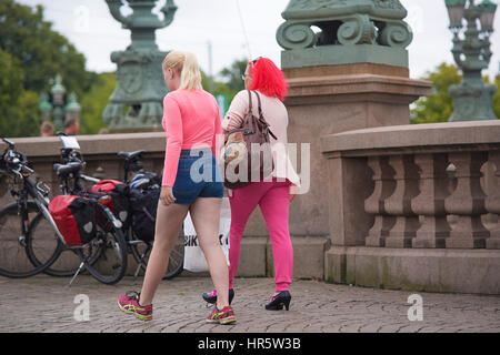 Women in pink clothes walking. Stock Photo